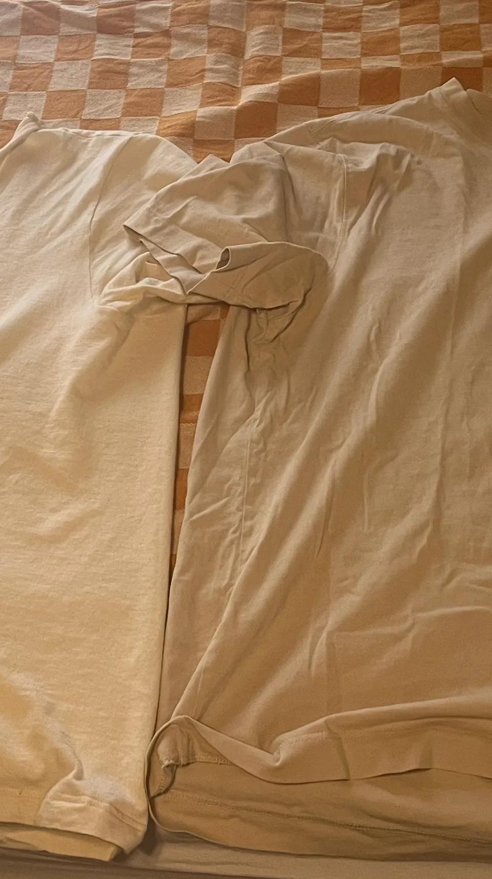 2 t shirts on a blanket